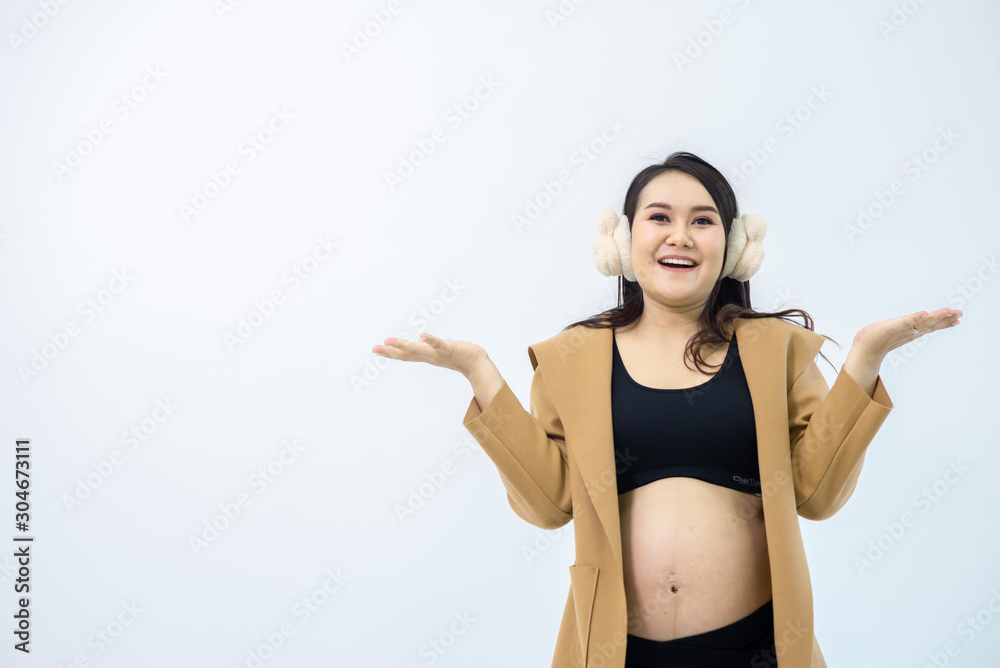 Pregnant women stand away from the white background