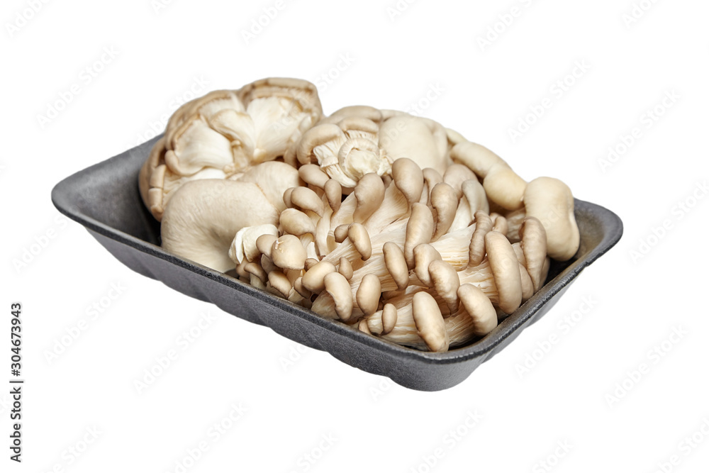 Oyster mushrooms in grey tray isolated on white background. Uncooked edible mushrooms Oyster mushrooms in grey tray isolated on white background. Uncooked edible mushrooms
