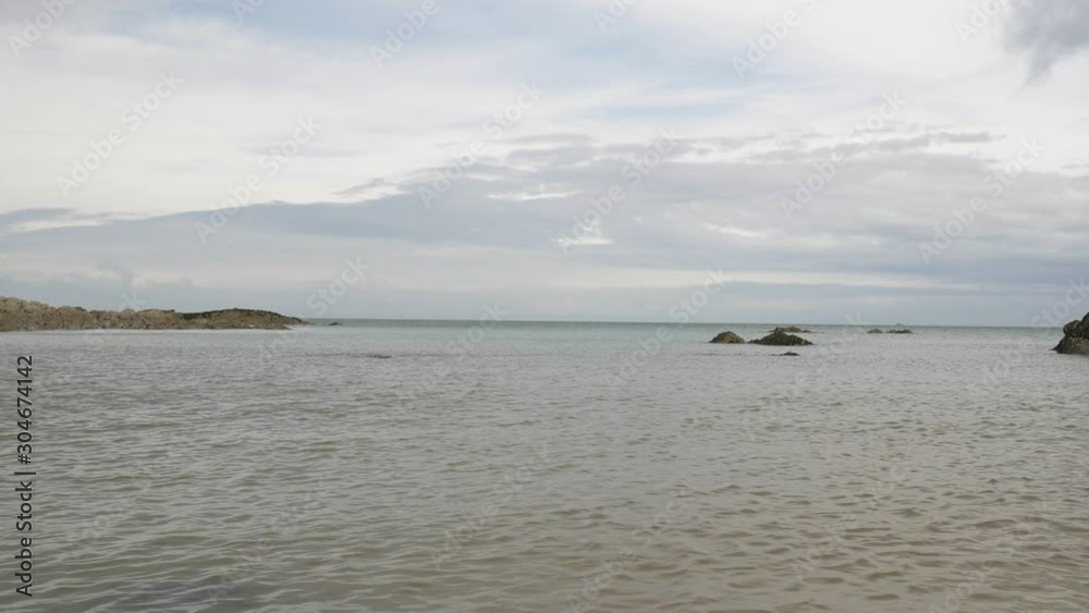 A Beautiful Shot of the Croyde Bay in North Devon with Calm Waters on a Summers Day A Beautiful Shot of the Croyde Bay in North Devon with Calm Waters on a Summers Day