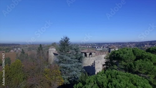 4k aerial forward low fly drone footage at noon time on top  of Statto castle in Trebbia Valley, Piacenza province, Italy. photo