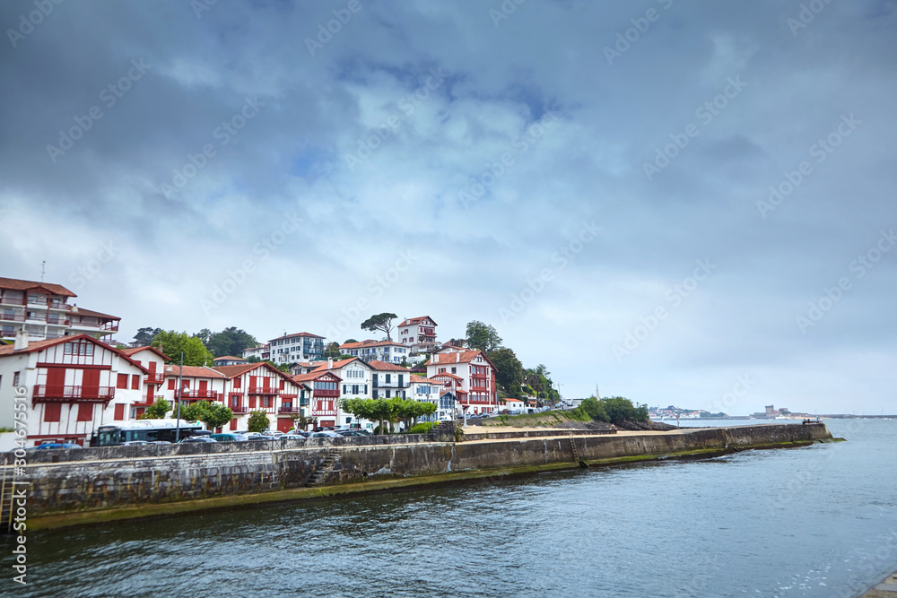 Embankment in Cibour, Basque Country, France. European town with traditional red and white half-timbered basque houses, typical architecture. Coastal town on the shore of the Bay of Biscay