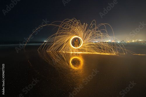 Playing with fire trails in Rimini beach