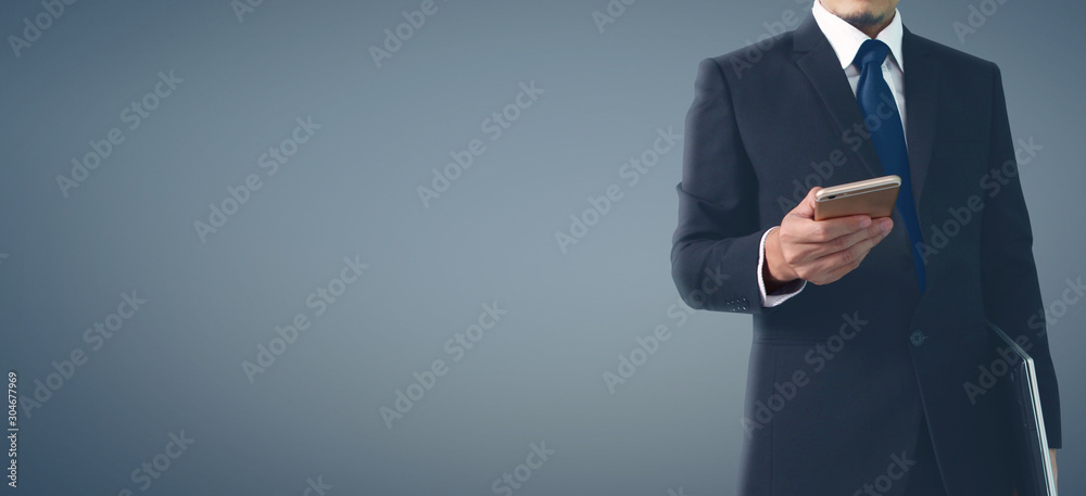 Man hand holding smartphone device and touching screen.business idea Man hand holding smartphone device and touching screen.business idea