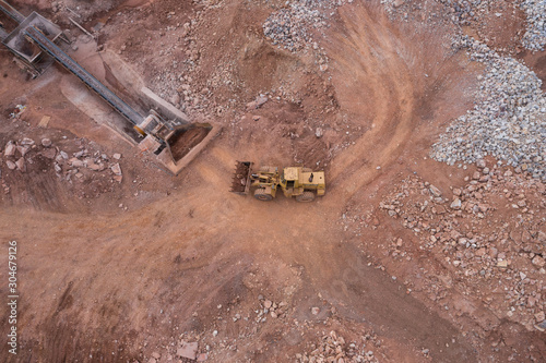 Aerial view of a large bulldozer working in a quarry