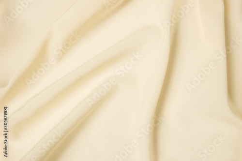 Abstract folds. Delicate silk drapery. Beige color.