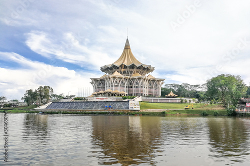 The Darul Hana bridge across Sarawak River overseeing the Sarawak State Assembly Building is popular tourist destination in Kuching.