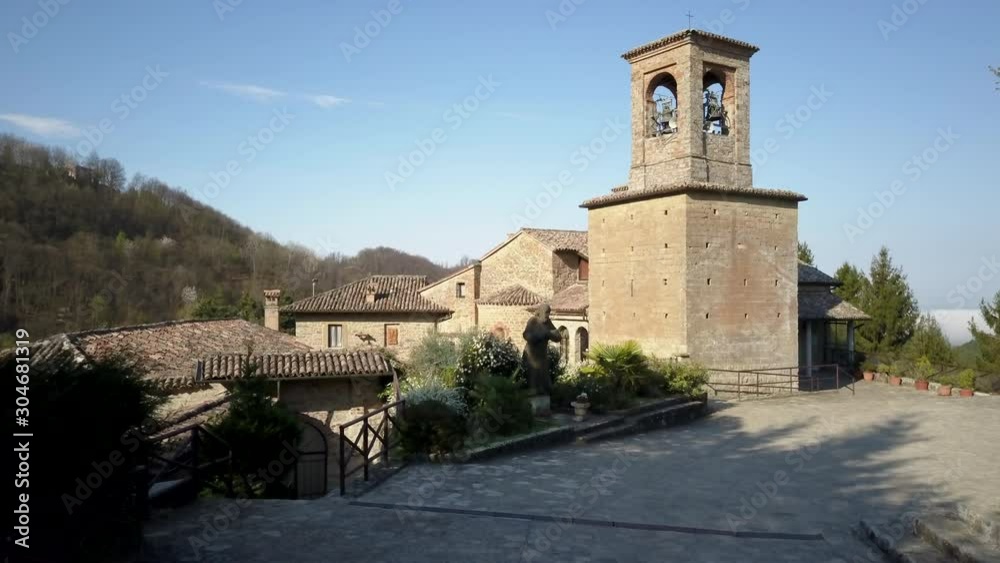 4k drone low fly forward aerial footage of ancien Sant'Alberto di Butrio hermitage in Oltrepò Pavese, Pavia province, Italy.