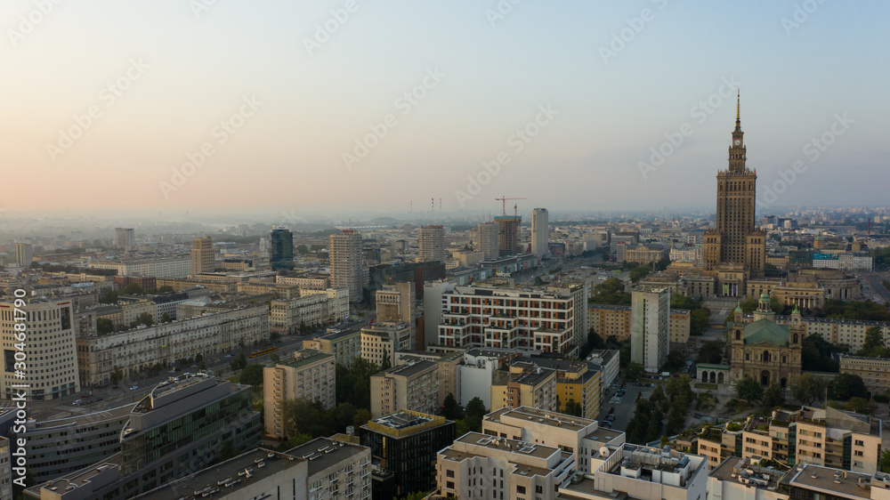 Warsaw, Poland. 26. October. 2019.  Cityscape with skyscrapers and knowledge and roads at sunrise.  Aerial view of the river and the city with skyscrapers and buildings in the early morning.