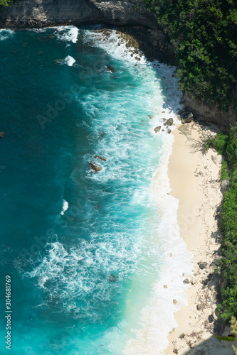 Amazing panoramic view of tropical beach, sea rocks and turquoise ocean, blue sky. Atuh beach, Nusa Penida island, island of Bali, Indonesia. Travel concept. Manta Bay or Kelkinkin Beach