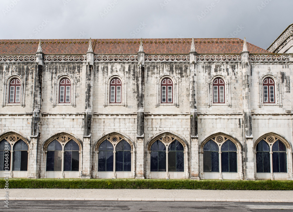 Arches with windows in stone monastery in Lisbon