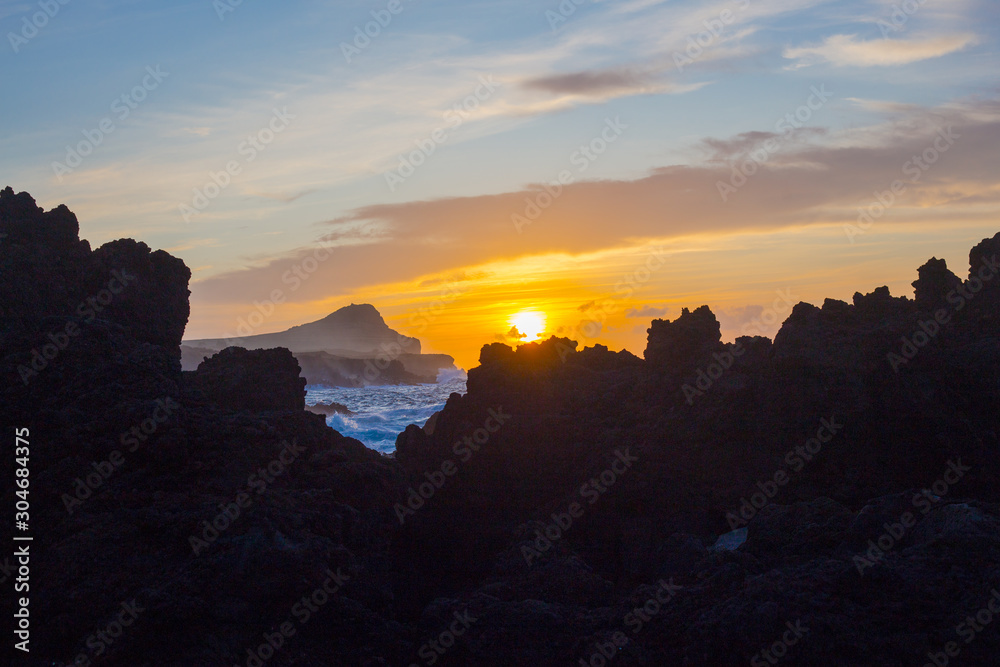 Lava stones on the beach of Piscinas Naturais Biscoitos. Atlantic Ocean. Terceira Azores, Portugal.
