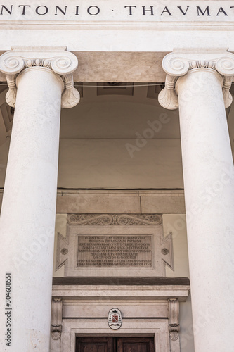 Close up view of the entrance of the catholic church Sant Antonio Taumaturgo located at the tourist spot Piazza Sant'Antonio Nuovo near the canal grande with its columns in Trieste, Italy