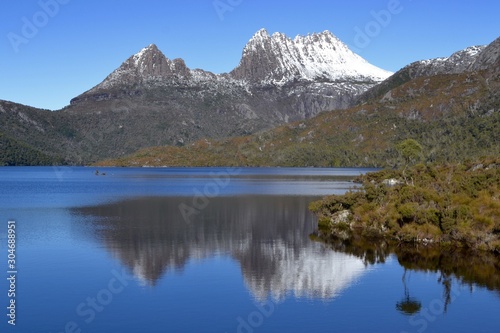 Snow capped peaks reflected in Dove Lake at Cradle Mountain National Park in Tasmania, Australia