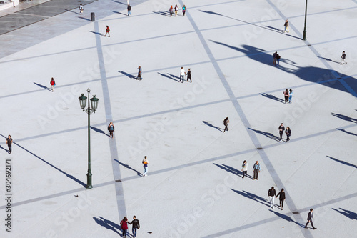 Lisbon, Portugal - May, 30th, 2018 : High angle view of passersby at Commerce Square as seen from the Miradouro do Arco da Rua Augusta viewpoint.
