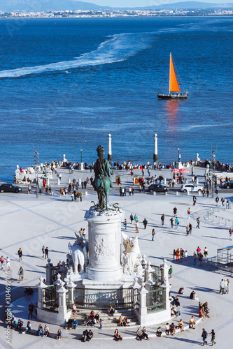Lisbon, Portugal - May, 30th, 2018 : Statue of King José I at Commerce Square with Tagus river in background as seen from the Miradouro do Arco da Rua Augusta viewpoint.