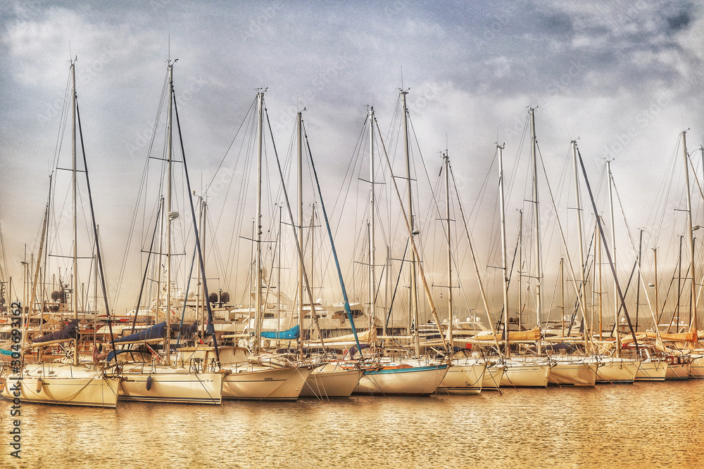 A row of yachts in Cannes Harbour artistic