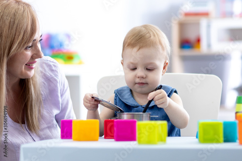 Baby toddler with mom play ...