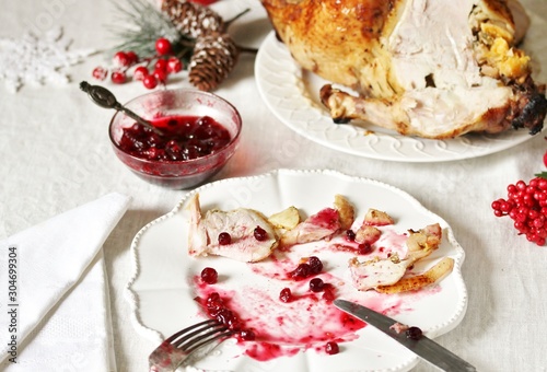 dirty dishes in the Christmas after eating turkey with cranberry sauce. leftover food after the holiday.dirty dishes after christmas. holiday leftovers