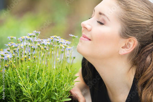 Woman smelling flowers