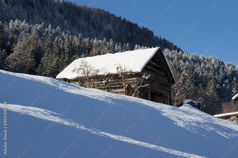 Snow-covered chalet in the Swiss Alps