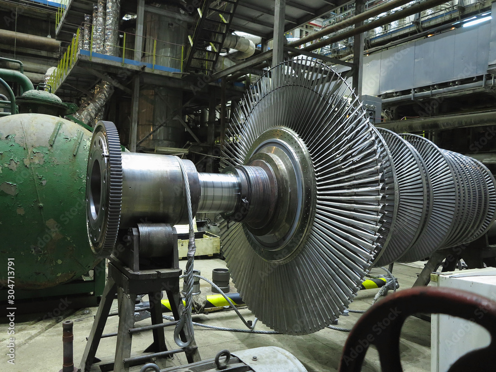 Power generator steam turbine in repair process, machinery, pipes, tubes at power plant
