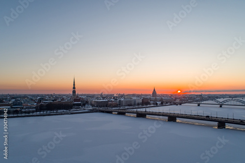 Aerial view on city of Riga, Latvia in early sunrise time winter season © Aleksandrs Muiznieks