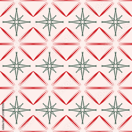 Retro Christmas mid century seamless pattern in vintage red and green with pink background. Stylized geometric design with 1950s, 1960's starburst. For gift wrapping paper, textiles and holiday cards.