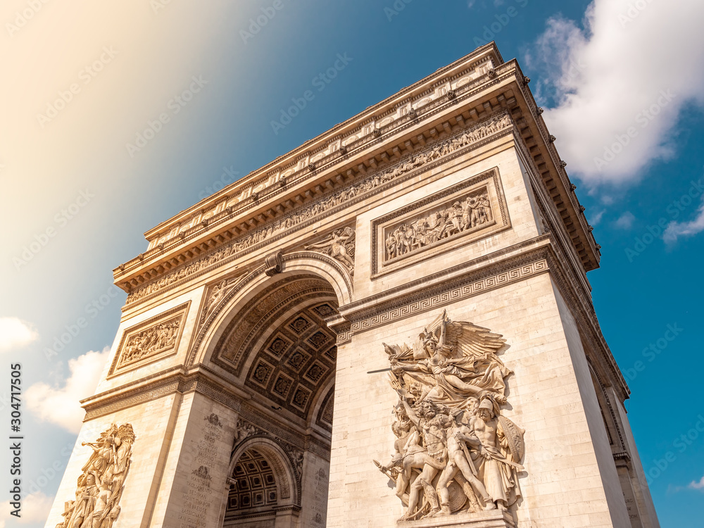 Arch of Triumph on a sunny day in Paris, France.