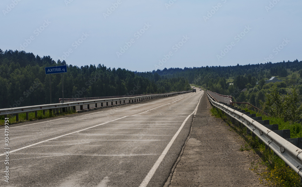 Fototapeta premium Entrance to the bridge over the river Vyatka