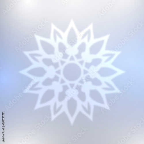 Abstract blue snowflake with blurred effect.
