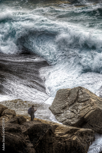
Fisherman in the storm, Atlantico, Galicia, Spain