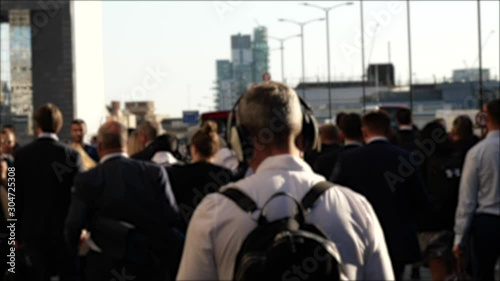 Group of business commuters walking towards station in sunset 4k diverse London population 
