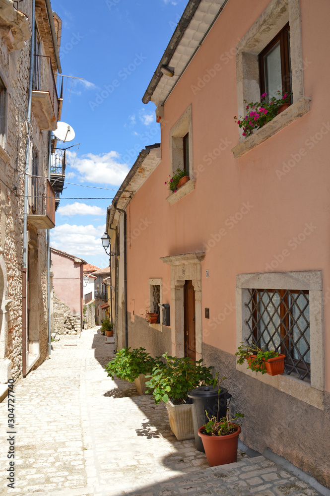 Sepino, Italy, 08/14/2017. A small street among the colorful houses of a village in the Molise region