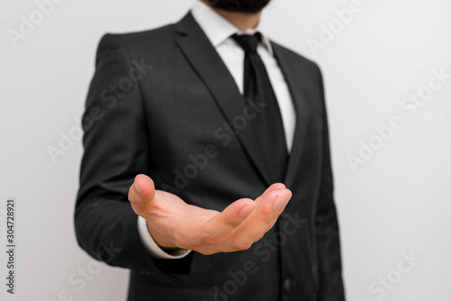 Male human with beard wear formal working suit clothes raising one hand up