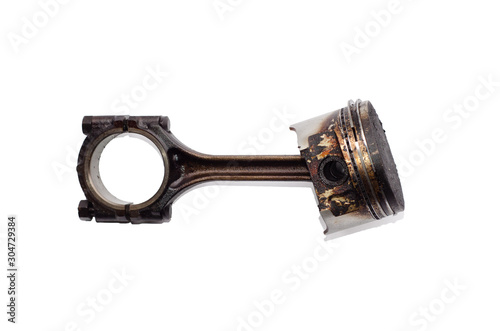 Piston with carbon deposits and connecting rod isolated on white