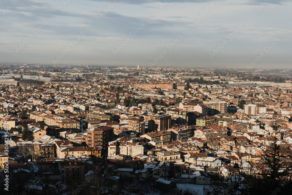 Italy, Cuneo city, top view of the city, winter, snow, house roofs