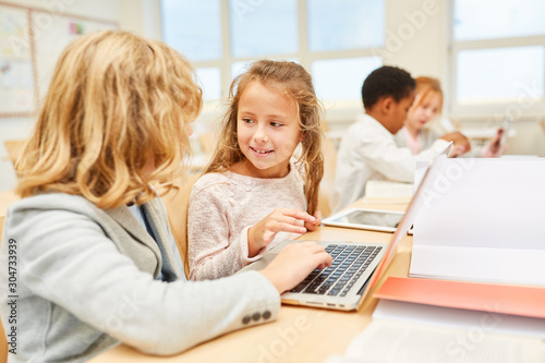 Pupils in the computer class at the laptop