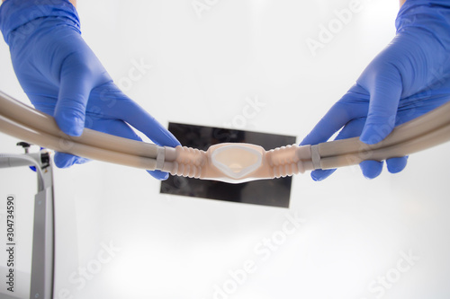 An anesthetist hands the patient under anesthesia before surgery. Sedation