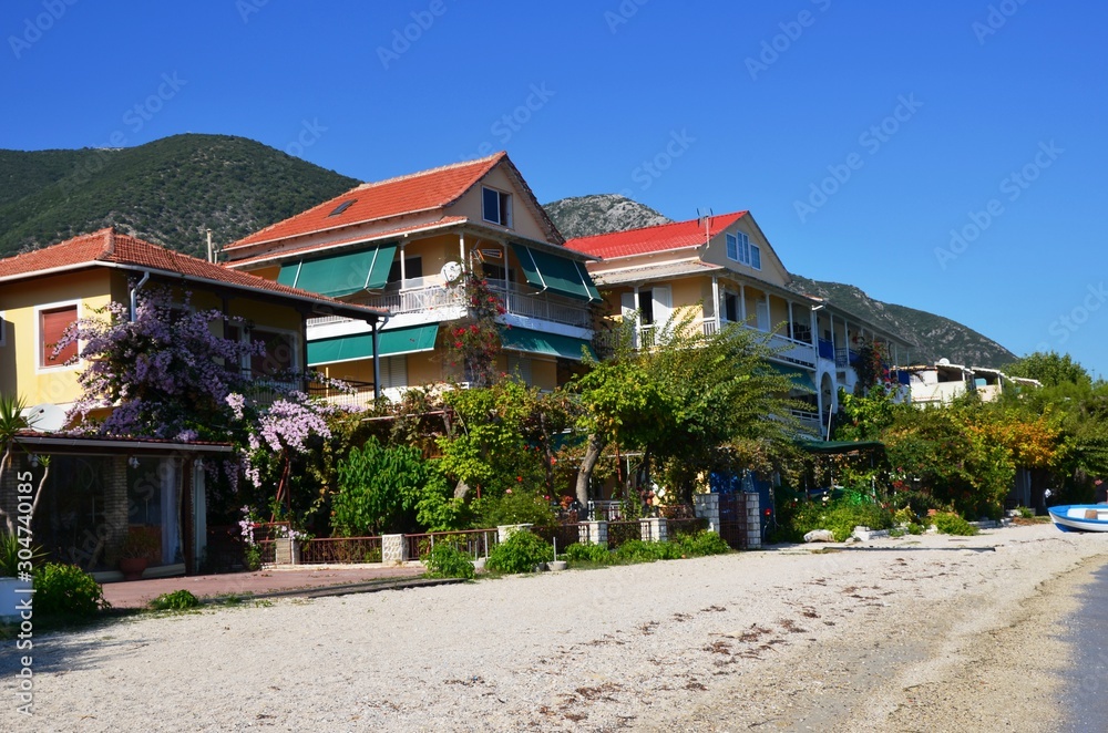 Nydri, Lefkada Island, Greece. 10/22/2019. buildings on the coast. beachfront apartments, beach without people Nydri, Lefkada Island, Greece. 10/22/2019. buildings on the coast. beachfront apartments, beach without people
