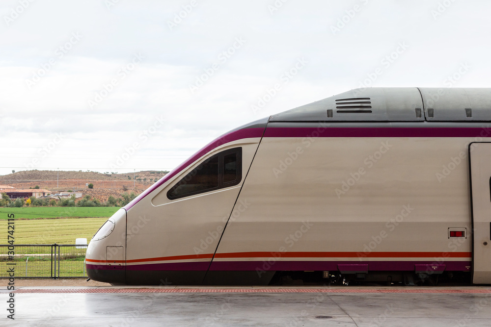 Naklejka premium a high-speed train car stands on a platform