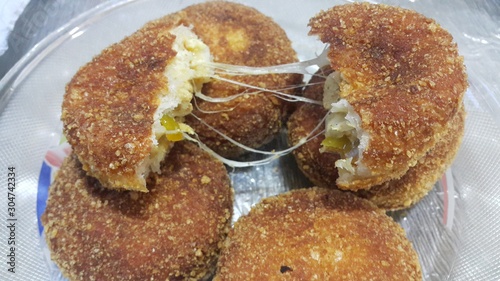 Closeup perspective view of fried pizza bombs or balls are altered form of pizza