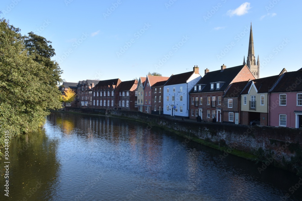 Views of Norwich Cathedral and River Wensum, on a sunny autumn day, from the Fye Bridge. Norfolk, England, UK.
