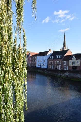 Views of Norwich Cathedral and River Wensum, on a sunny autumn day, from the Fye Bridge. Norfolk, England, UK. photo