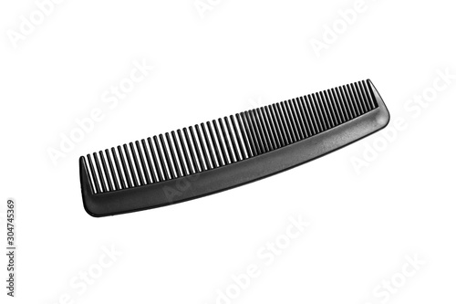 Black comb on white background.Hairdressing accessories