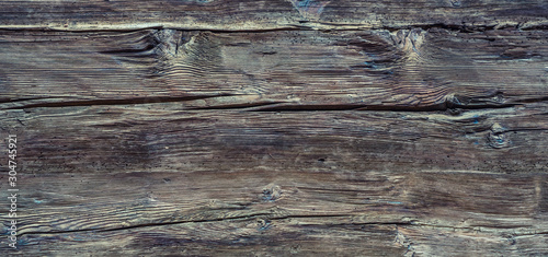Tableau sur toile The wall of old wooden house in traditional swiss alpine village