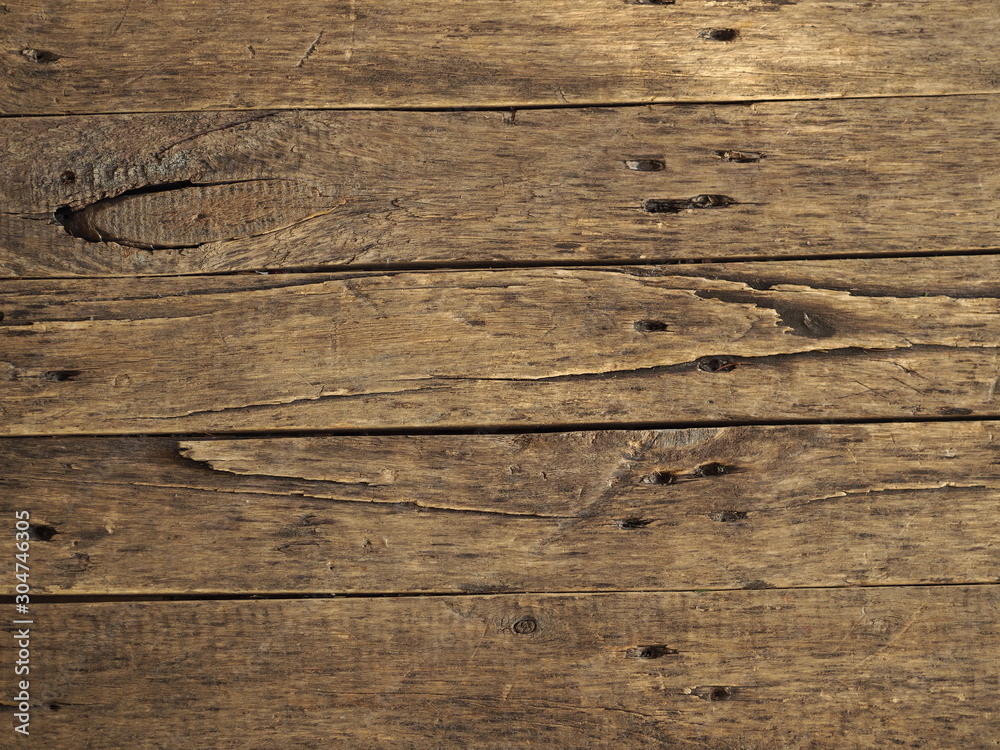 Naklejka premium wooden decorative ancient gray from old planks brown background