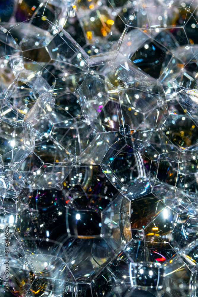 Close Up of Bath Water Bubbles Foam For Background In Black Rainbows Close Up of Bath Water Bubbles Foam For Background In Black Rainbows