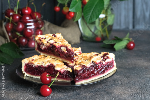 Delicious Homemade Cherry Pie with a Flaky Crust on dark background
