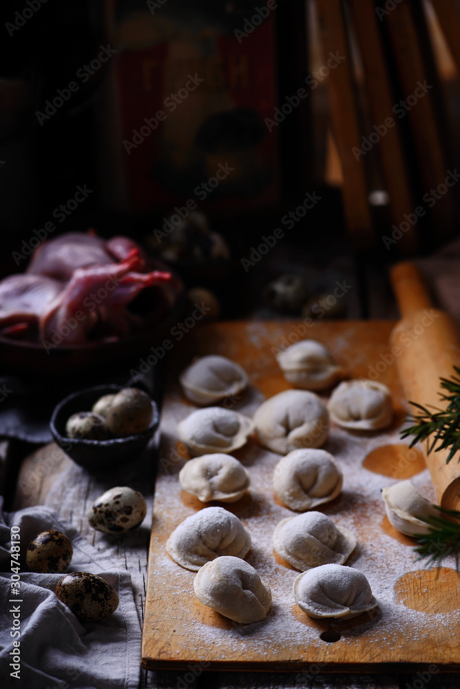 Pelmeni on wooden board.style rustic.