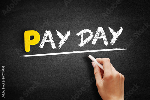 Pay Day text on blackboard, business concept background